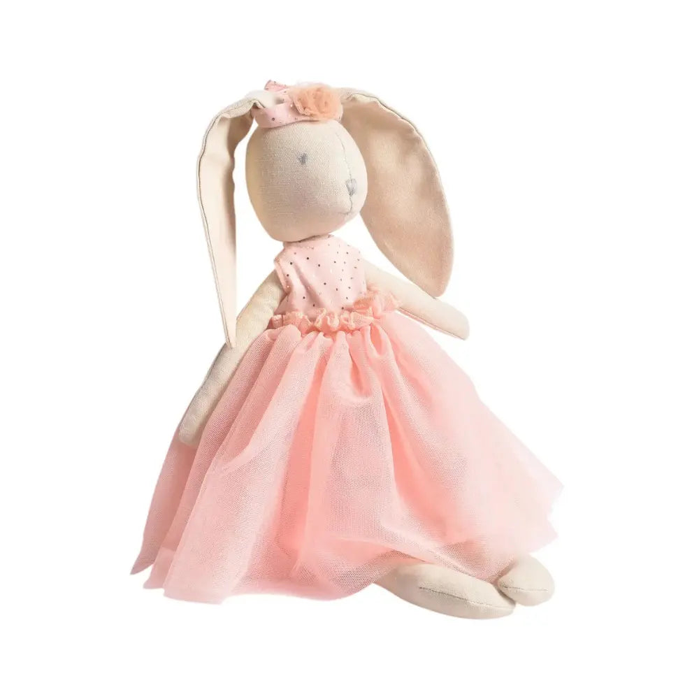 Stuffed bunny toy with a pink dress on a white background