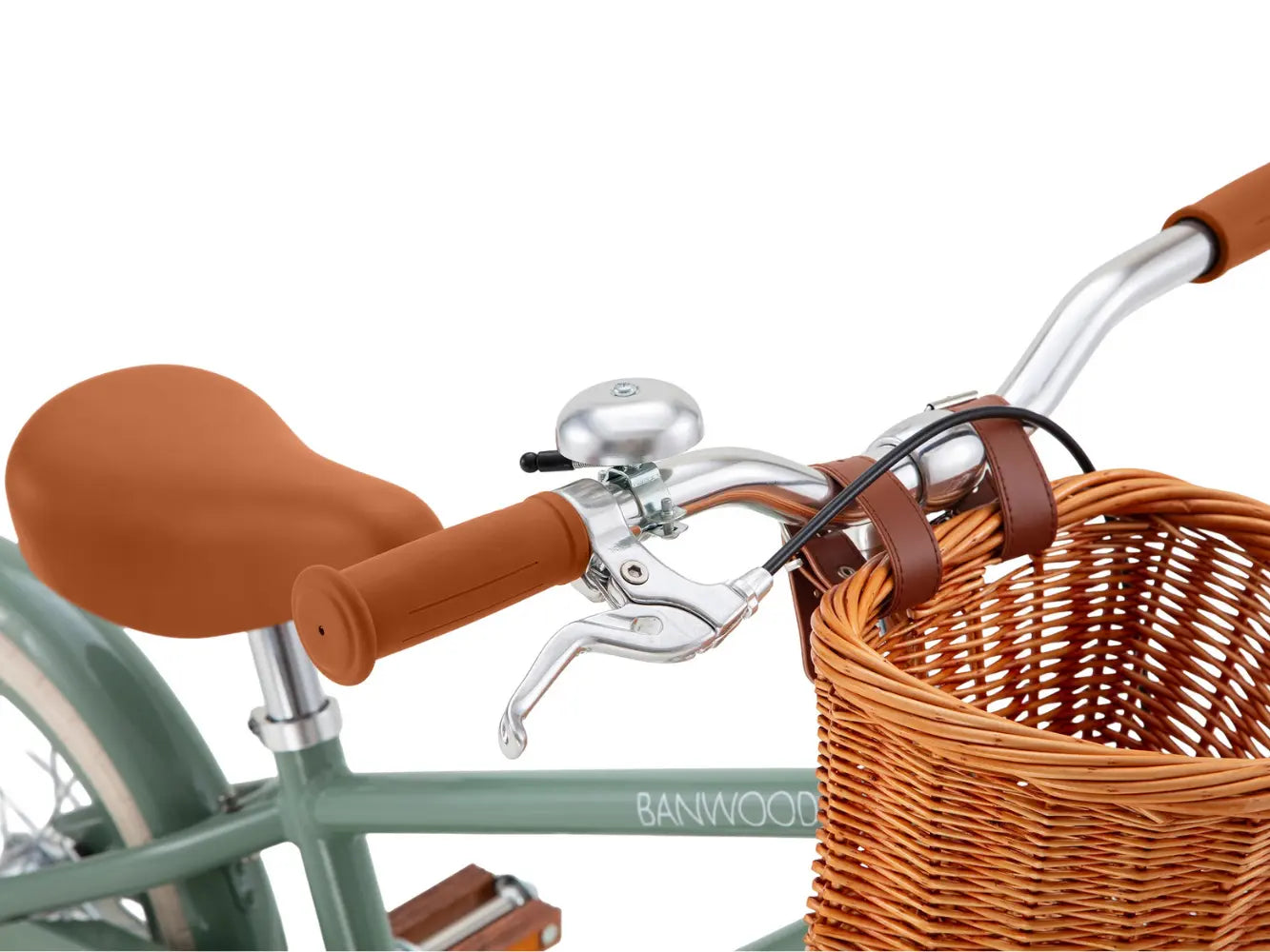 Close-up of a bicycle handlebar with brown grips, bell, and basket, featuring the Banwood brand.