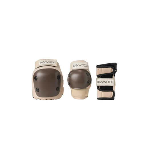 A set of Banwood protective gear including a knee pad, elbow pad, and wrist guard in beige and brown, displayed against a clean white background.