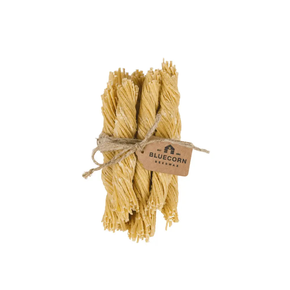 Bunch of beeswax wick firestarters tied with twine and a Bluecorn label on a white background