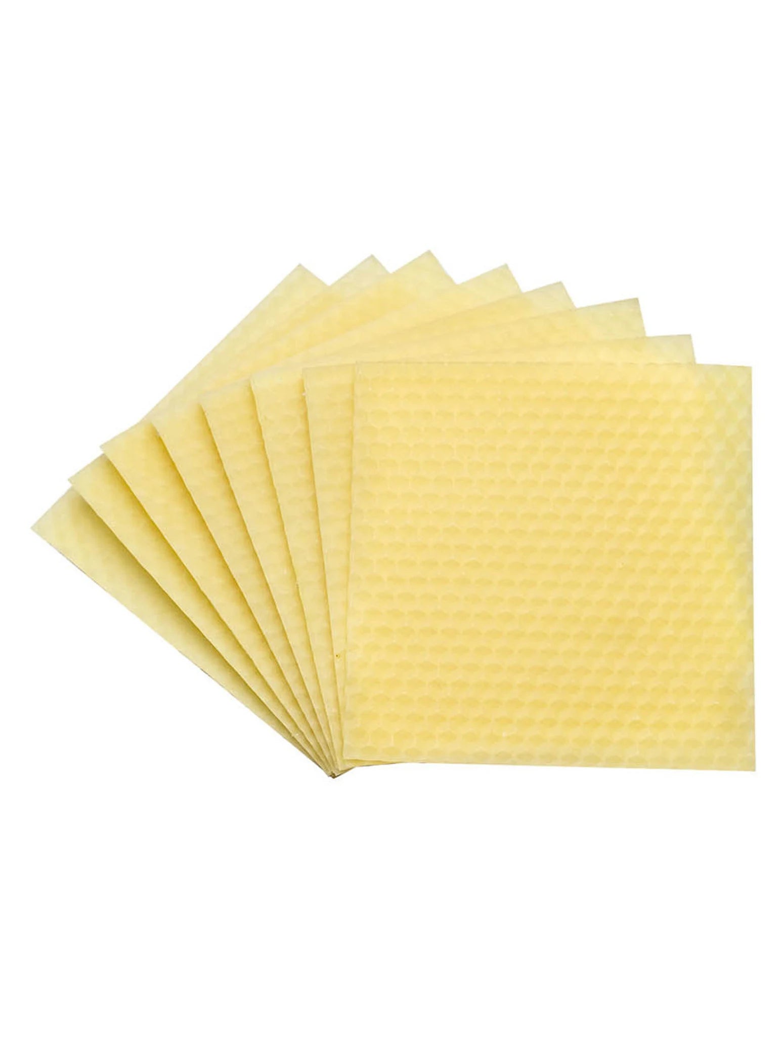 Set of yellow honeycomb wax squares on a white background