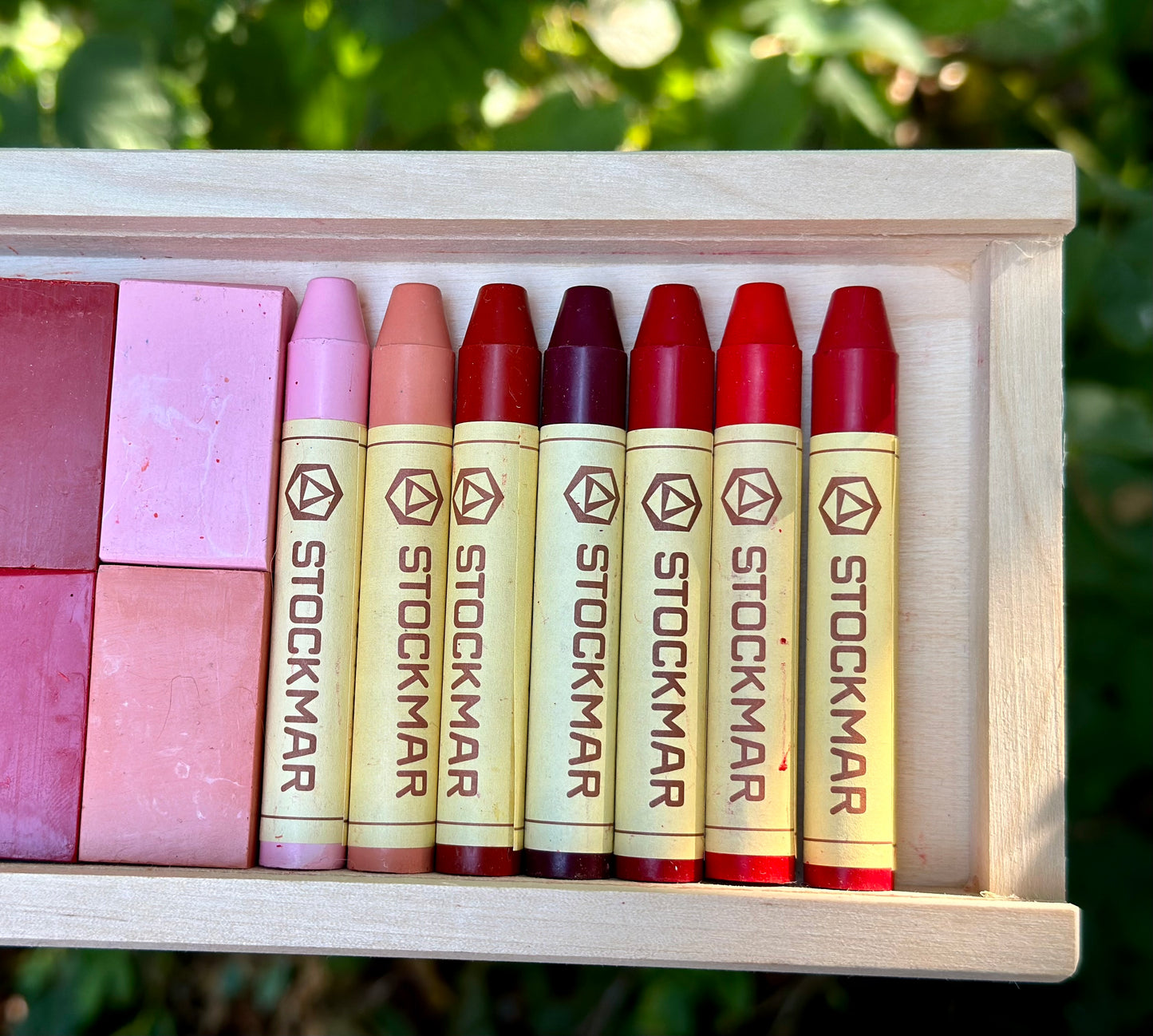 Stockmar beeswax stick and block crayons displayed together showing shape comparison