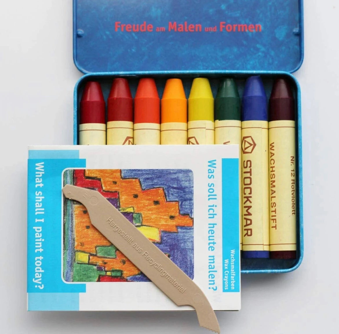 Stockmar beeswax stick crayons set of 8 in open metal tin showing crayons and included scraper tool