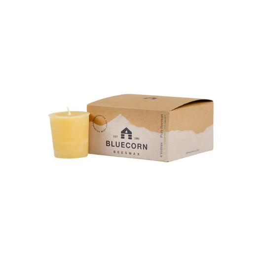 Beeswax candle next to its packaging box with 'Bluecorn' branding on a white background