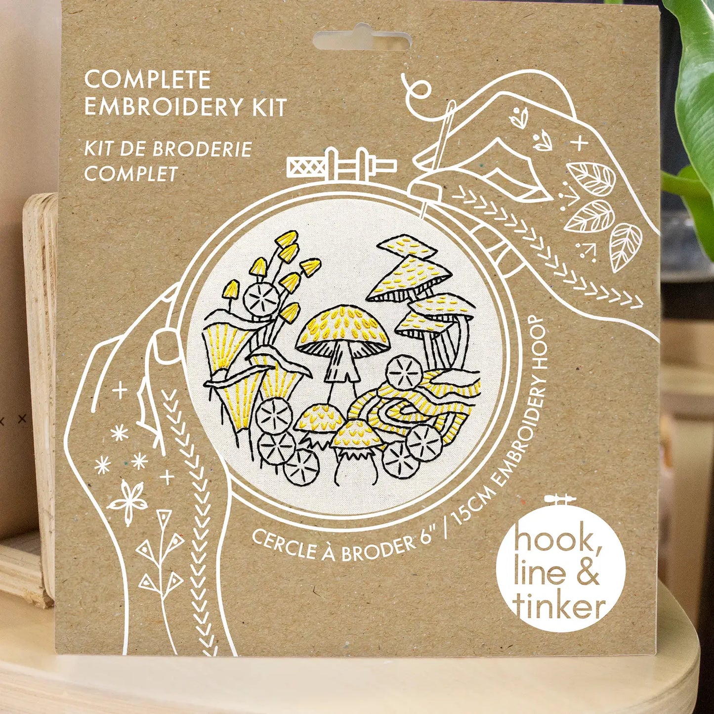 Close up of the packaging for the beginner embroidery mushroom project kit