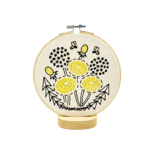 Finished dandelion embroidery hoop art with bees and yellow flowers