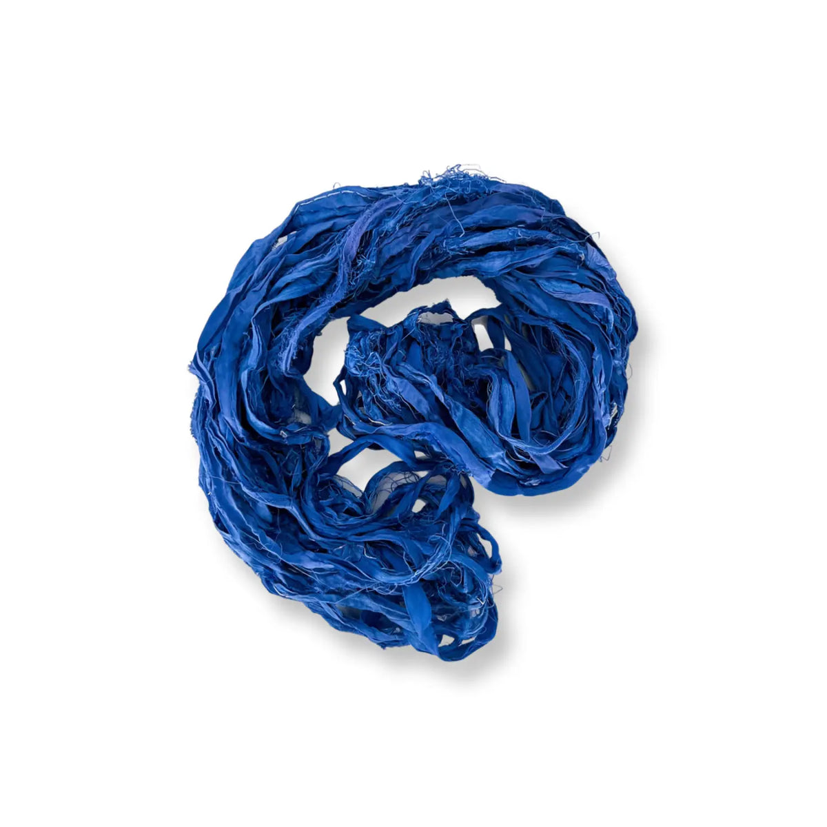 Loosely coiled hank of royal blue recycled sari silk chiffon ribbon yarn, Bermuda Ocean Blues colorway