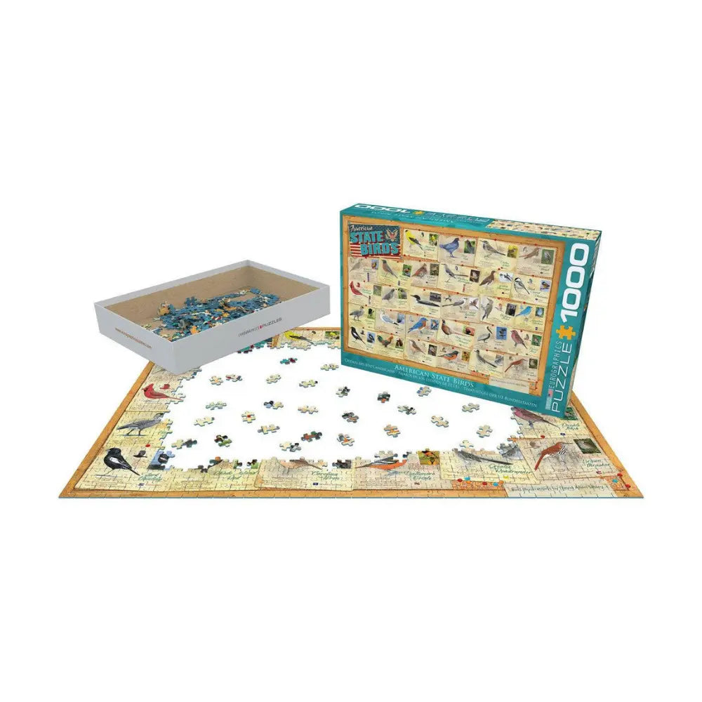 Jigsaw puzzle with pieces on a mat and packaging on a white background