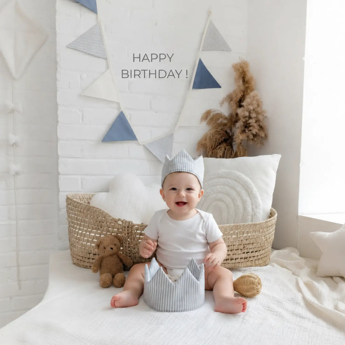 Baby wearing a blue striped natural linen dress-up crown with adjustable ties as a birthday crown