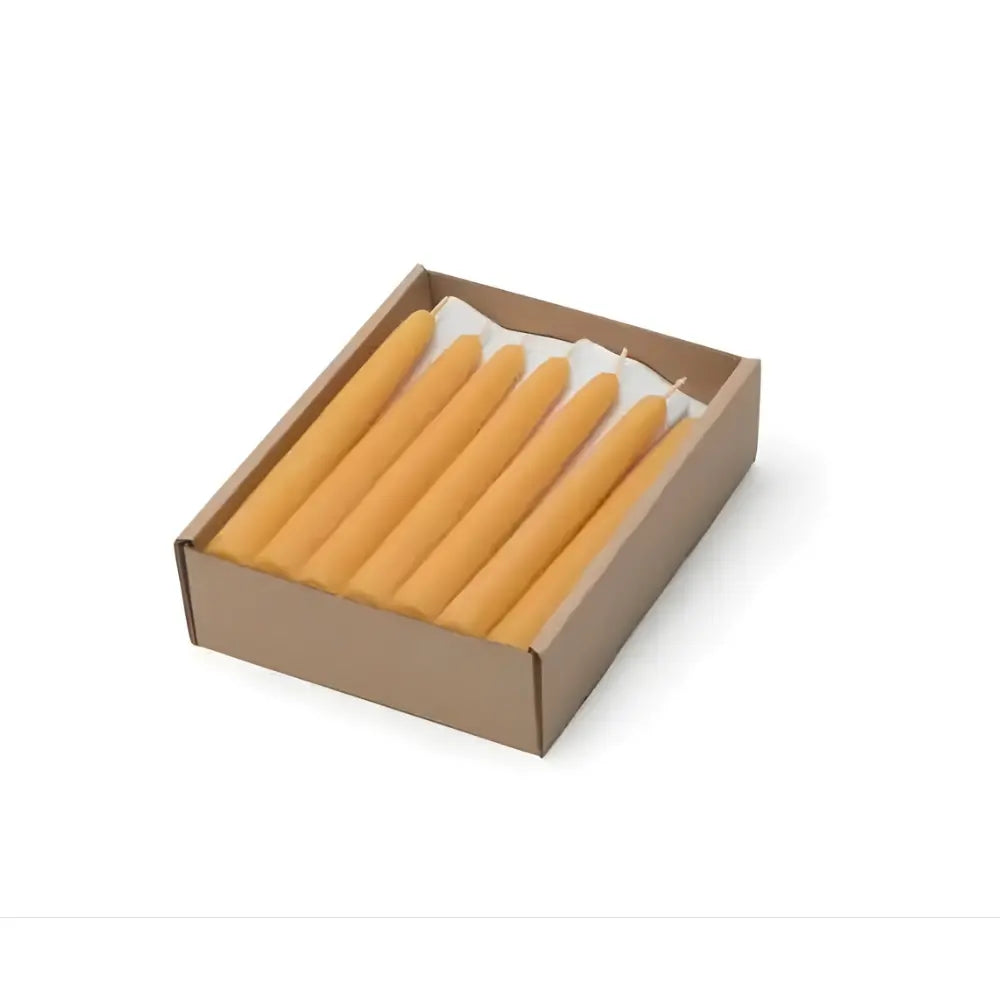 Box of yellow candles on a white background