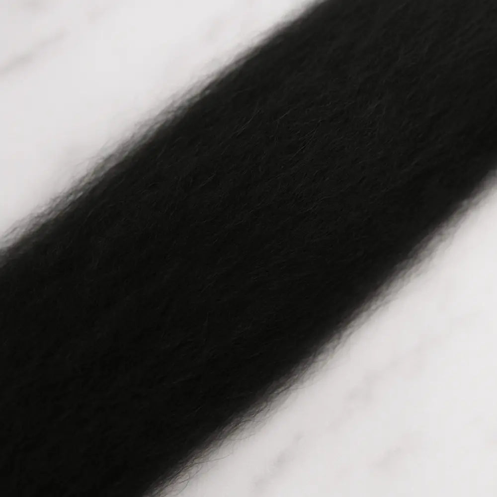 Close-up of black superfine Merino wool sliver fiber for spinning and felting