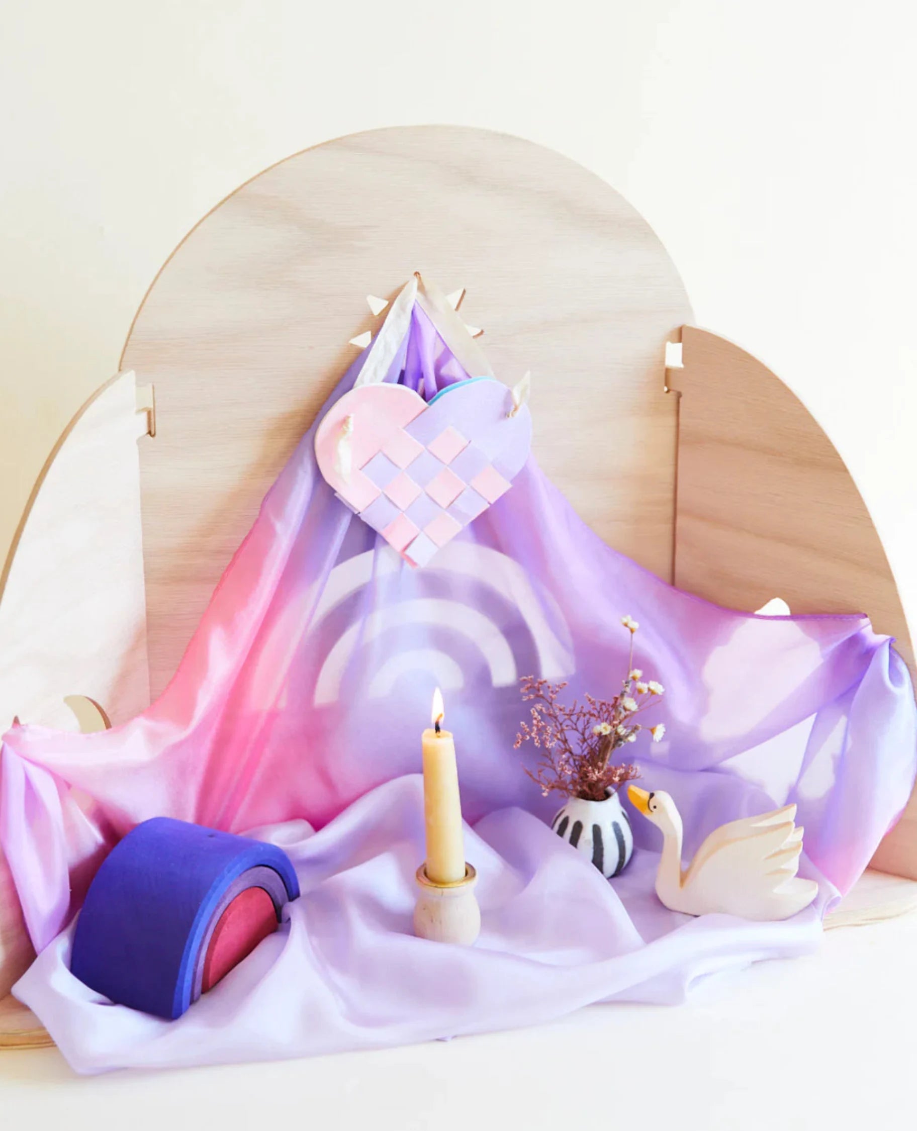 Wooden nature table frame with blossom playsilk, hearts, candles, wooden toys