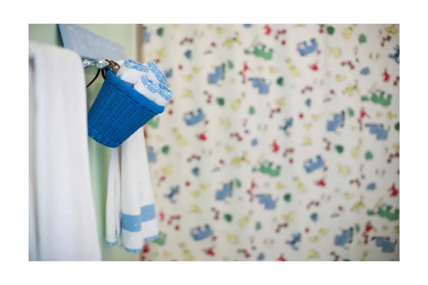 Children's room with colorful bedding featuring cartoon characters.