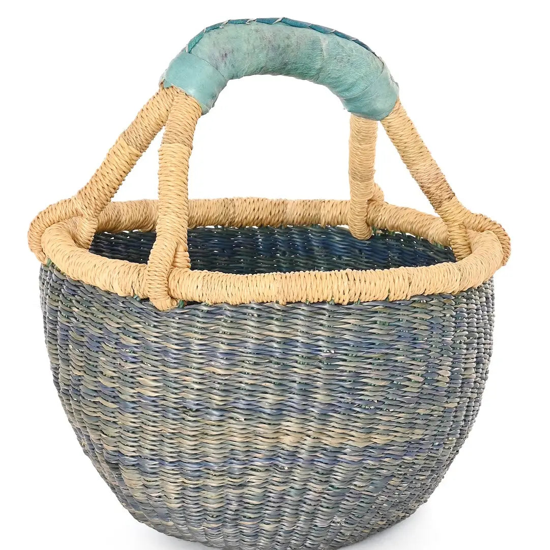 Woven basket with a blue handle on a white background
