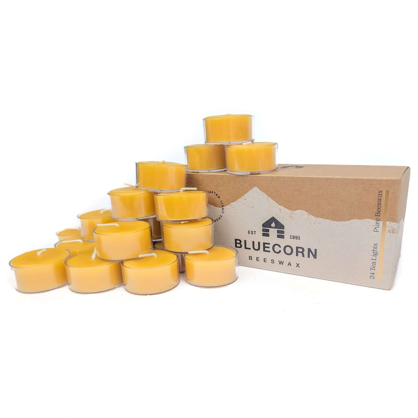 Box of Bluecorn Beeswax candles with multiple candles stacked on top