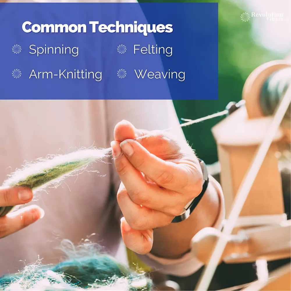 A person's hands drafting wool with a spinning wheel
