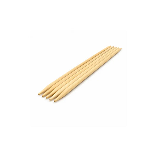 Brittany 10 inch double pointed wooden knitting needles arranged on a white background.