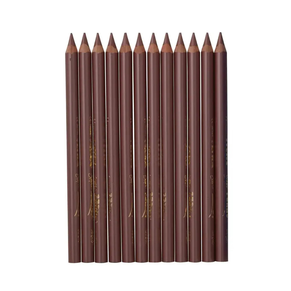 Set of sharpened bronze metallic pencils side by side on a white background