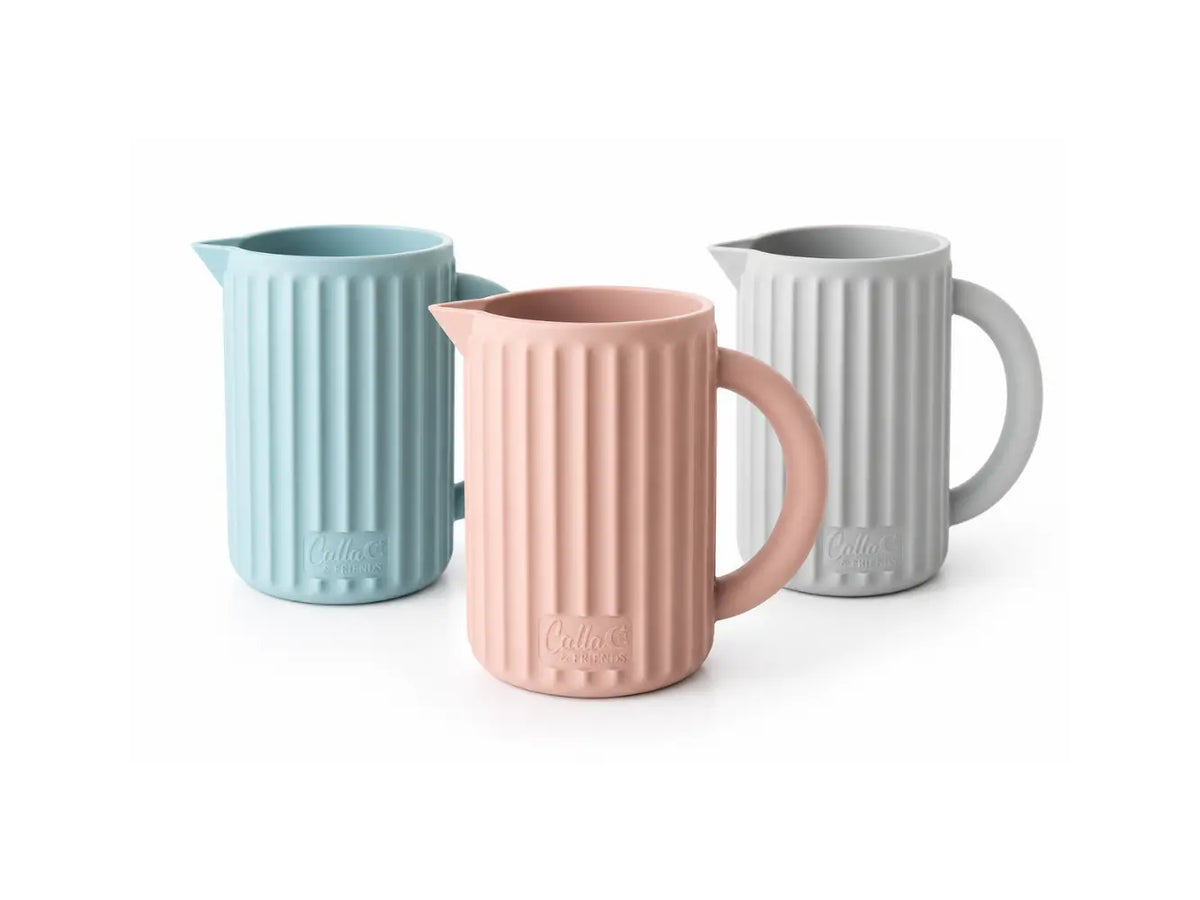 Rinse Cups in pink, powder blue, and whisper grey arranged in a staggered lineup on a white background.