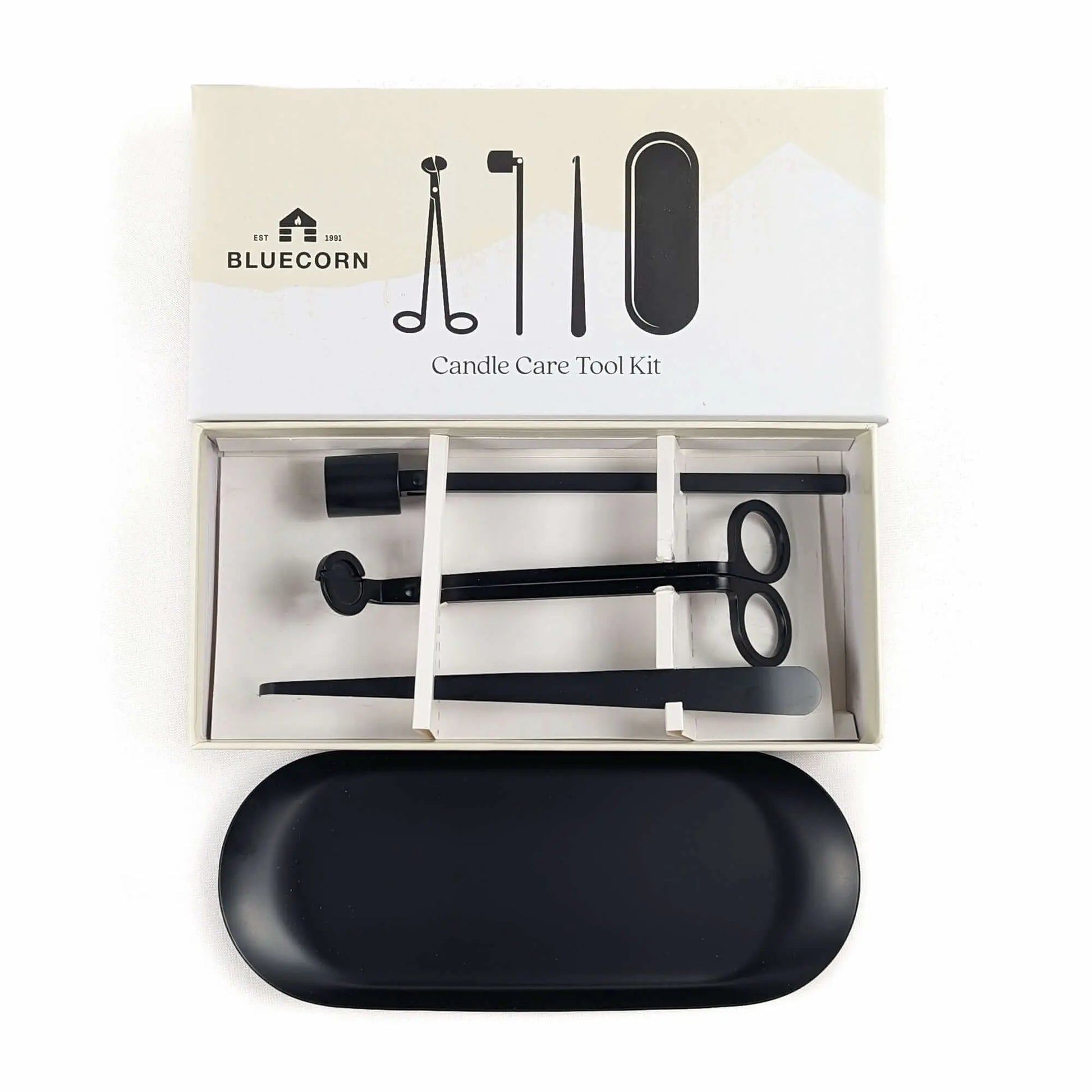 Candle care tool kit with tools and a black tray in packaging, branded as Bluecorn.
