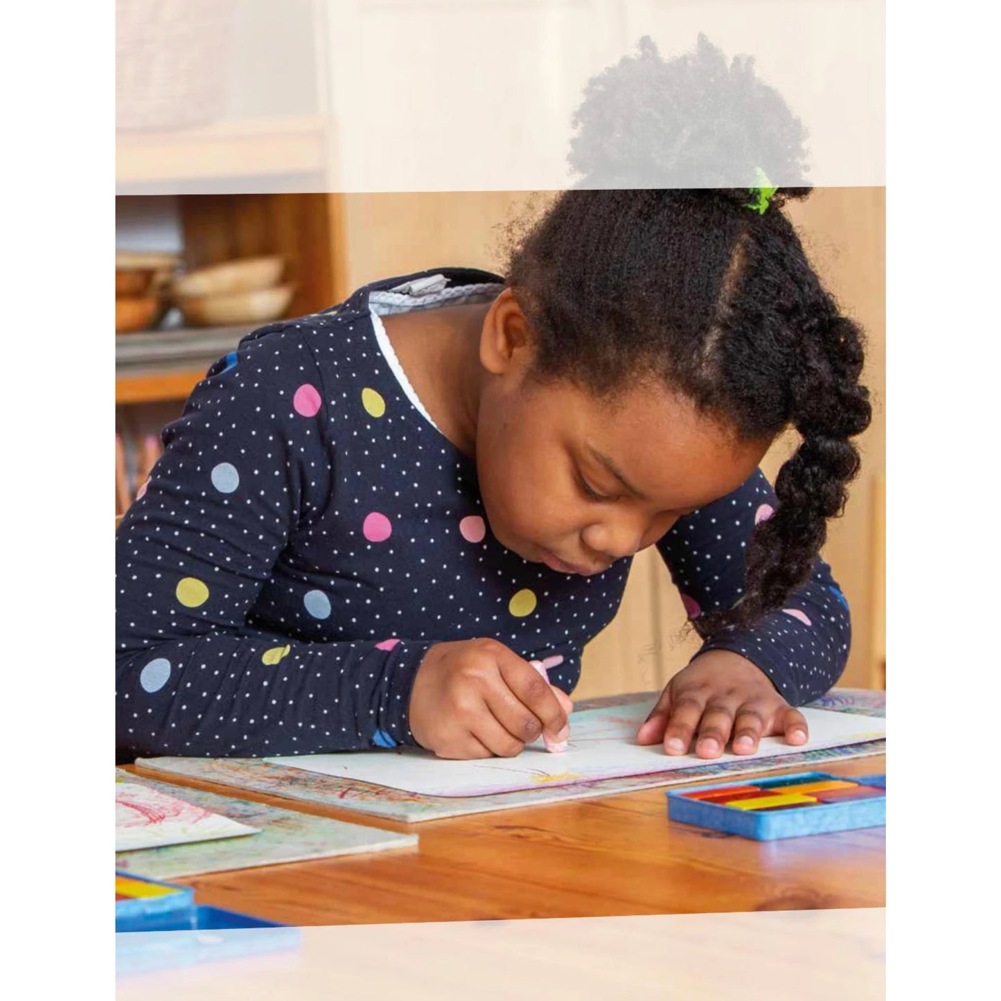 child coloring with beeswax crayons showing rich color application on paper