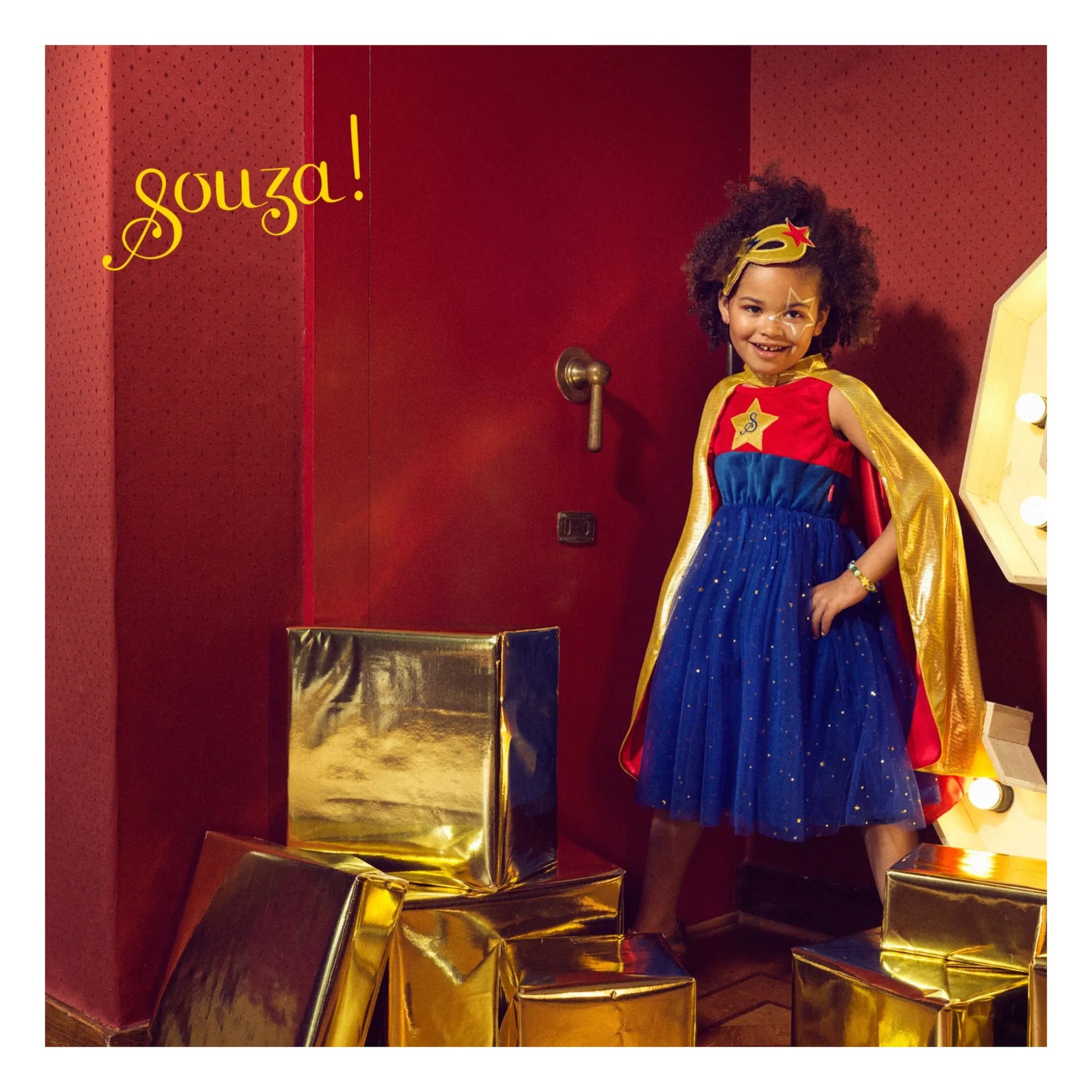 Child wearing superhero dress and cape set for imaginative play and costume use