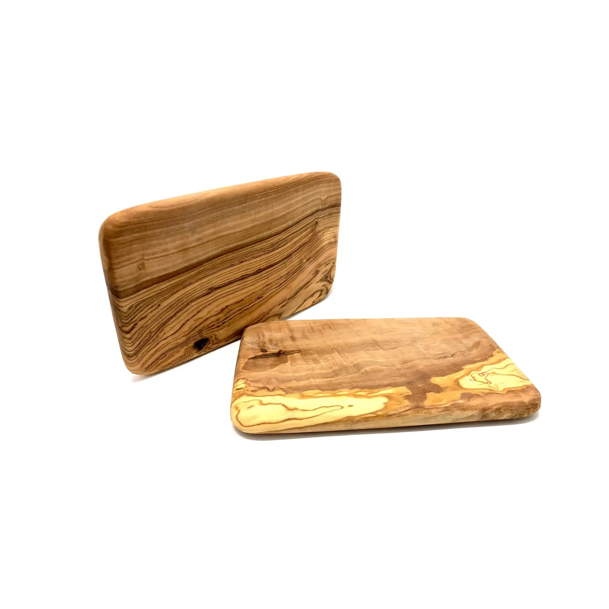 Two olive wood breakfast or cutting boards on a white background