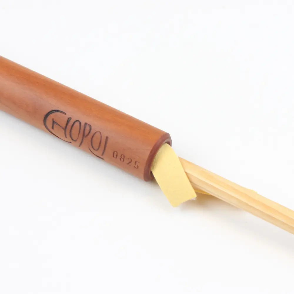 Wooden pear wood flute with 'Choroi'branding on a white background