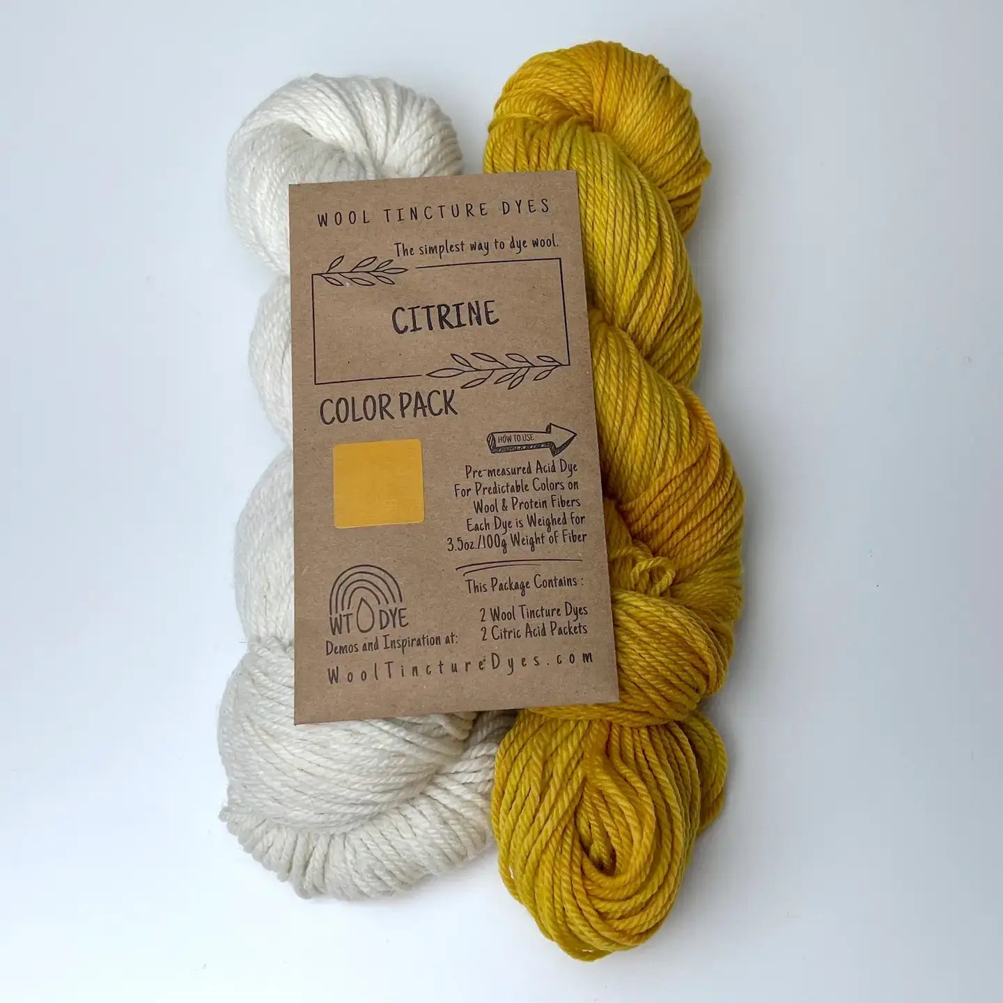 Citrine Wool Tincture tea bag dye color pack with undyed yarn and golden yellow sample color.