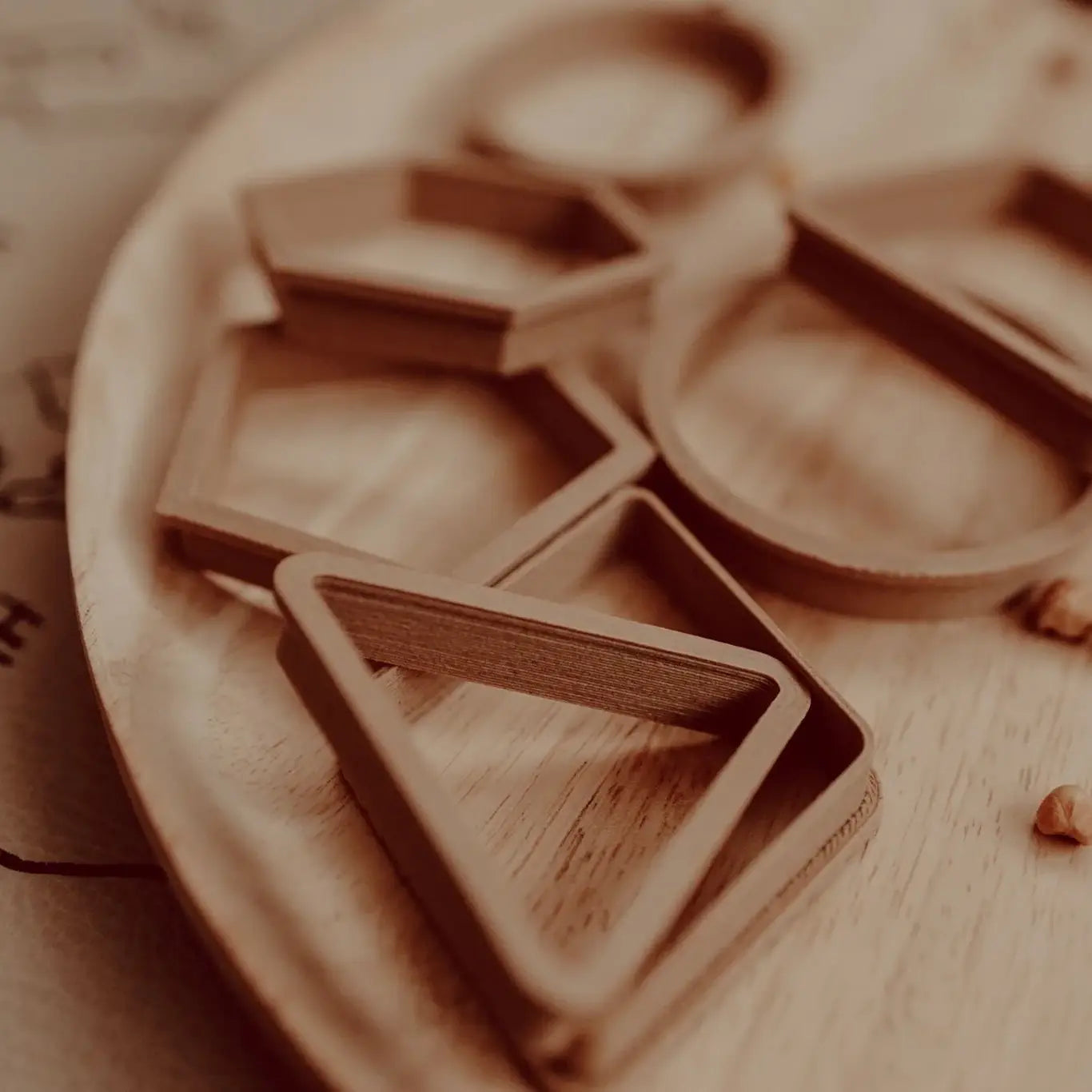 Wooden cookie cutters on a wooden surface