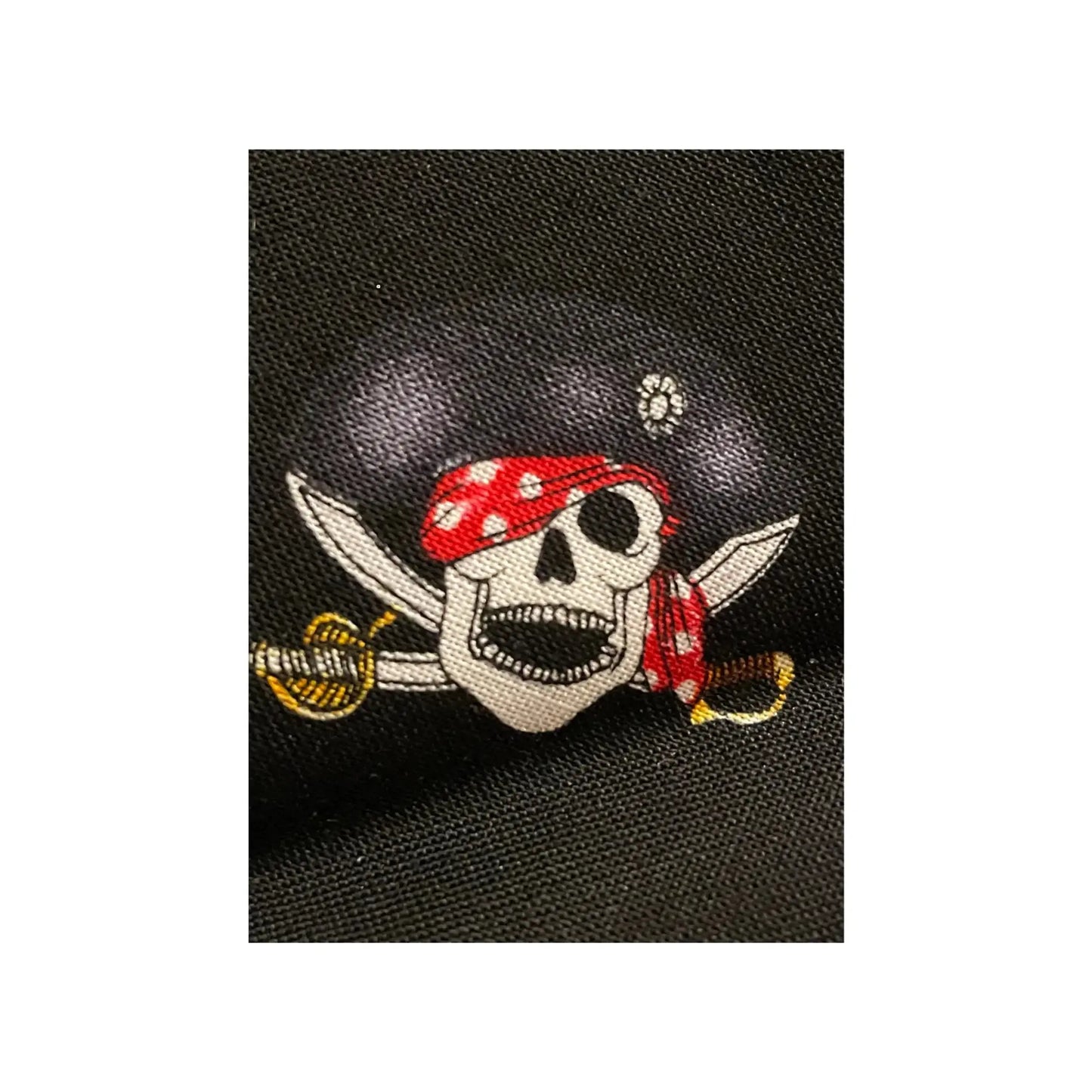 Pirate-themed patch with skull and crossed swords on a black background