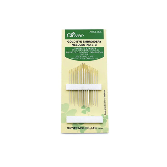 Package of gold eye embroidery needles on a white background