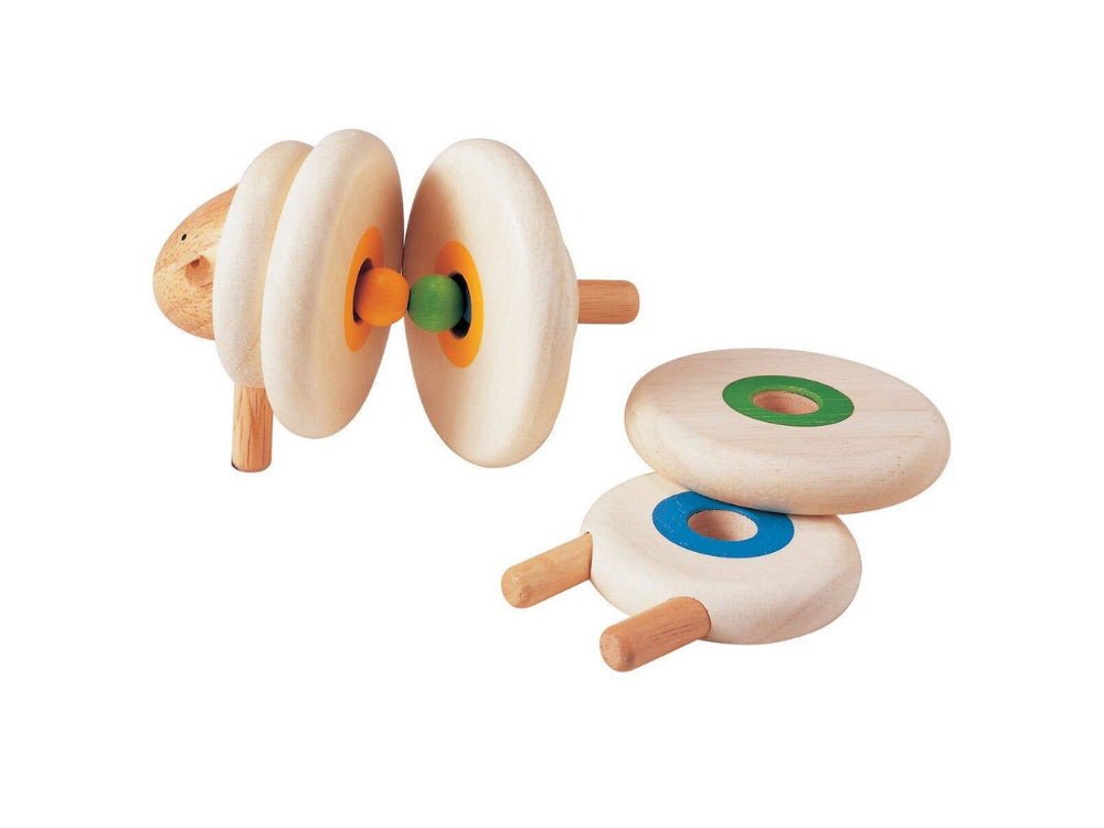 Wooden lacing toy with multiple wooden cylindrical parts with colors on a white background