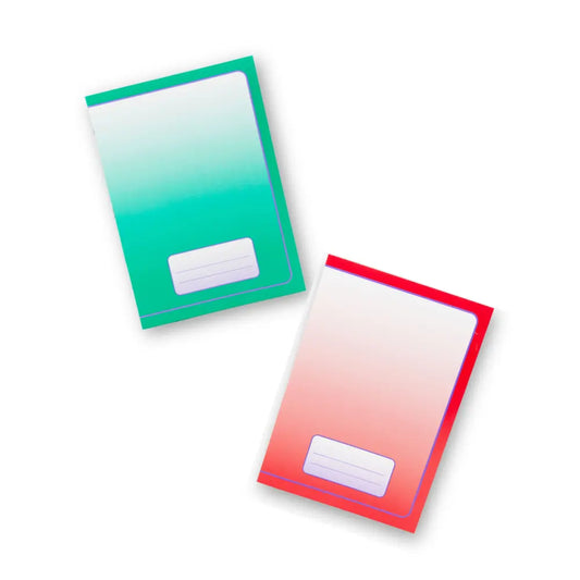 Two gradient notebooks, one green to white and one red to white, on a white background.
