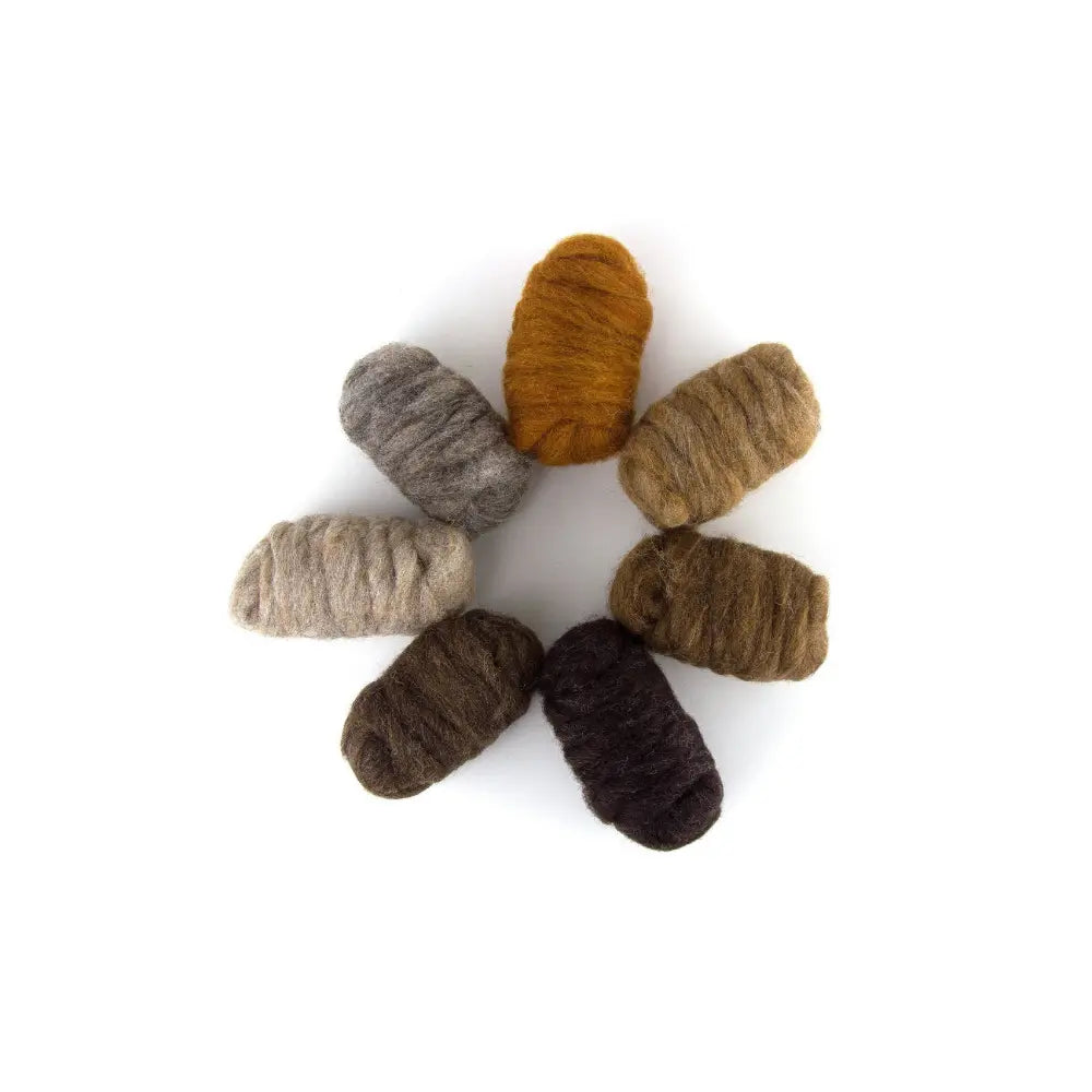 Set of brown and gray natural wool rovings slivers for needle felting on white background