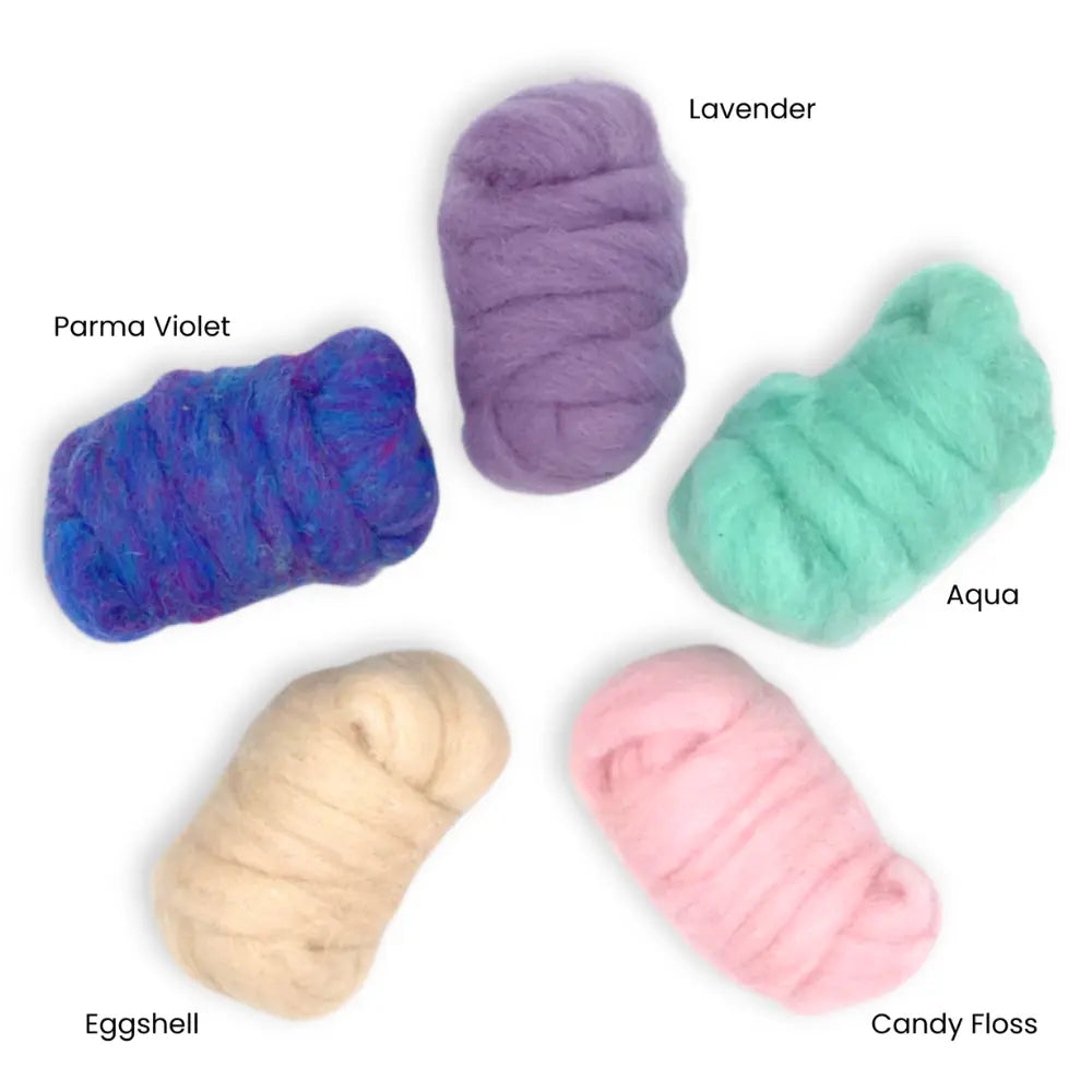 Five balls of pastel-colored corriedale wool with name labels