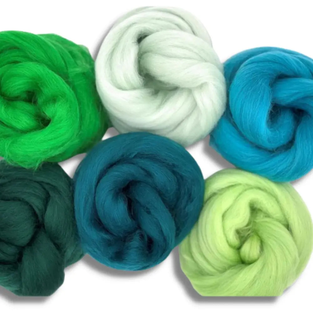 Group of six Corriedale wool skeins in blues, greens, and blue-greens