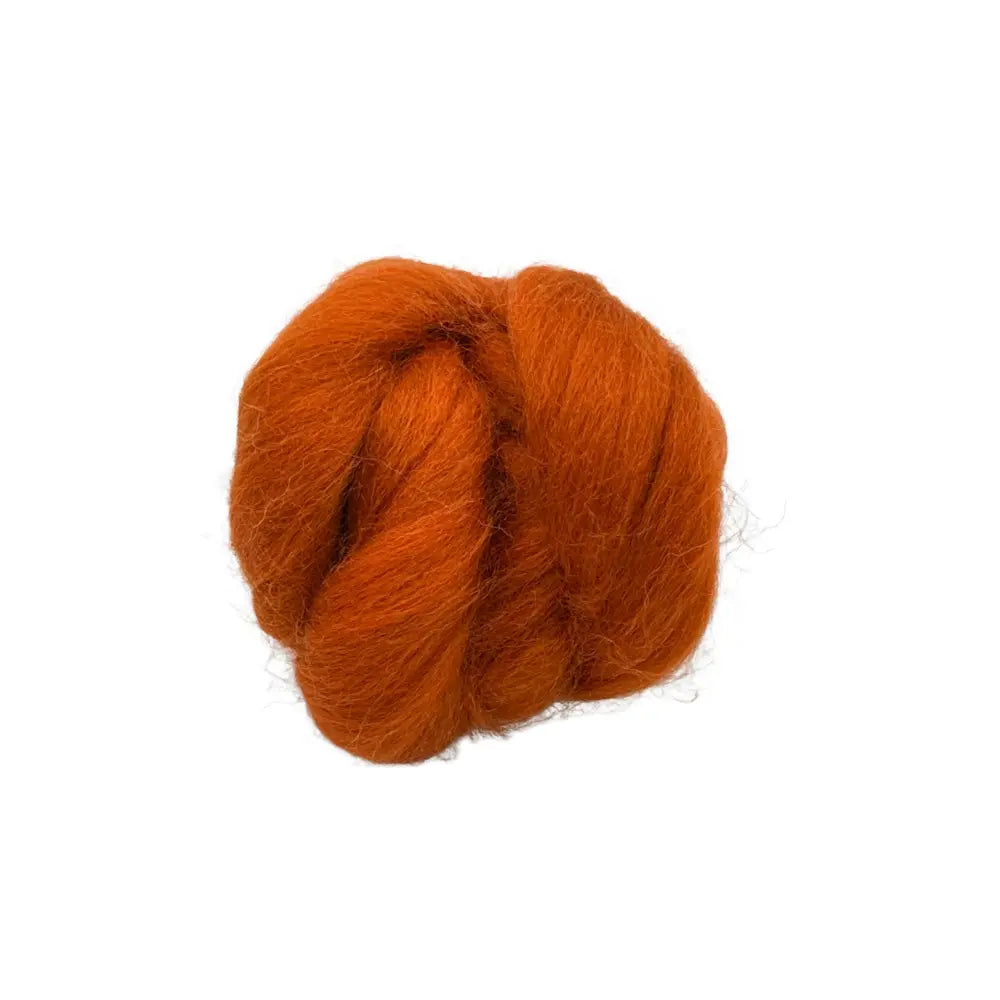 Rust Corriedale wool spinning fiber on a white background