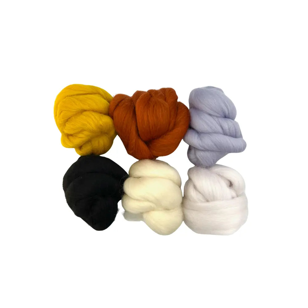 Set of six skeins of wool in yellow, orange, purple, black, white, and beige on a white background