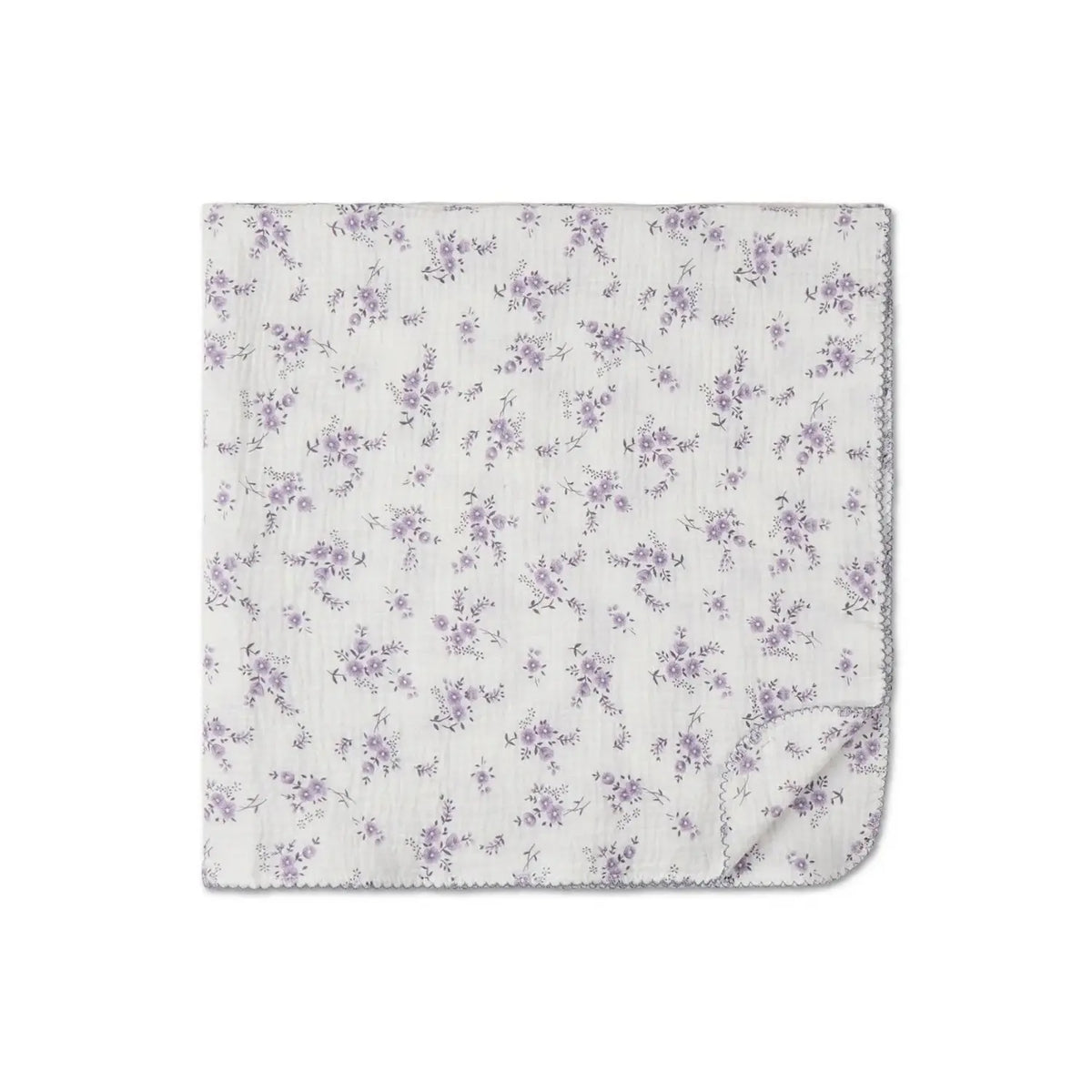 100% cotton baby swaddle blanket in lavender floral print shown flat with corner folded