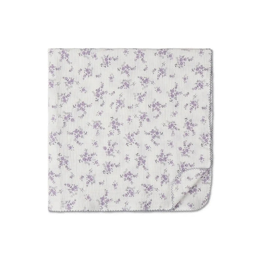 100% cotton baby swaddle blanket in lavender floral print shown flat with corner folded