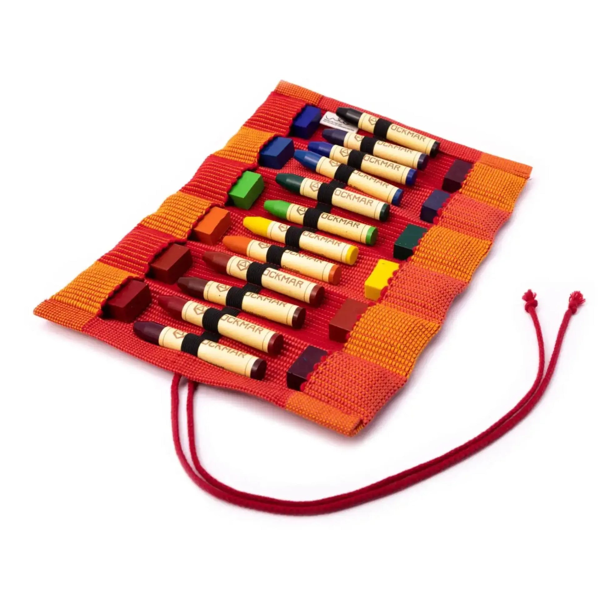 Set of colorful crayons in a woven red crayon case on a white background