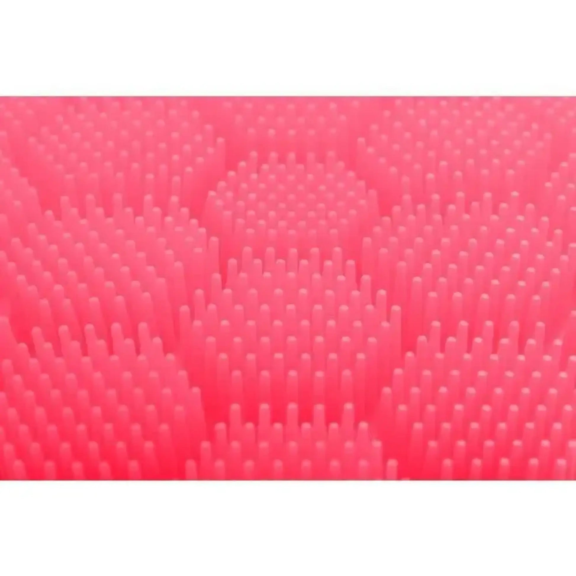 Close up of the pink raised textured surface of the soft silicone scrubber for cradle cap, hair washing, hand washing for children