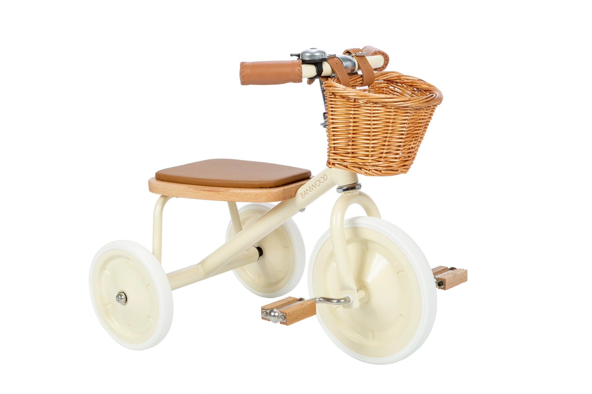 Children's tricycle with a wicker basket on a white background
