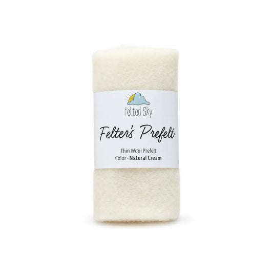Cream colored wool prefelt in a roll used for wool paintings