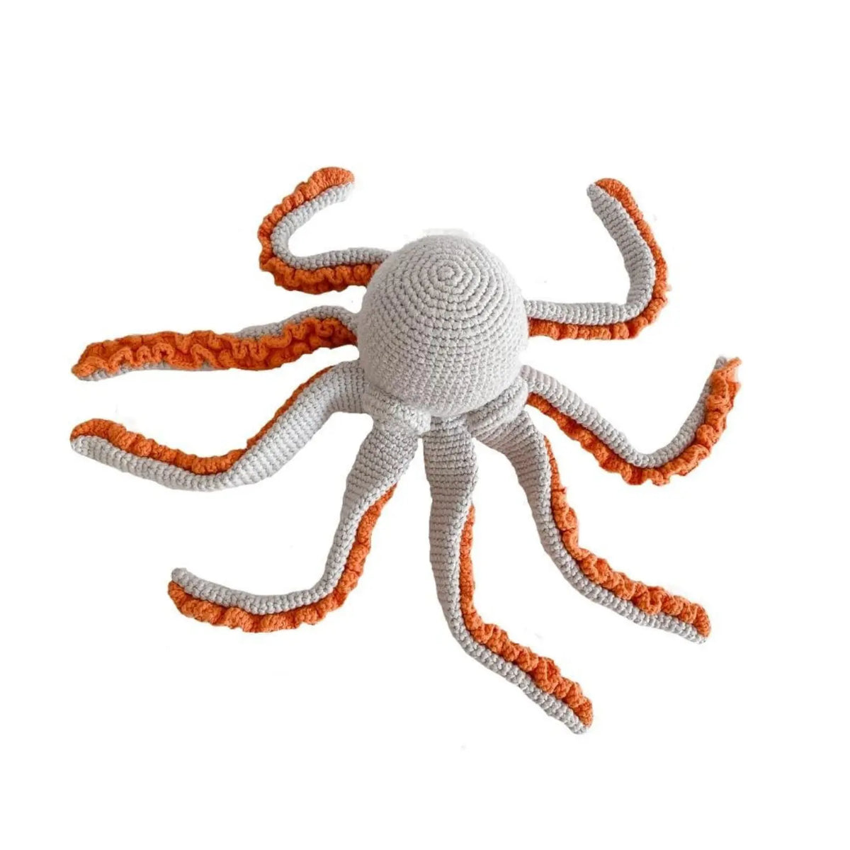 Light gray crochet octopus soft toy seen from above with its eight curling, orange-ruffled arms spread out