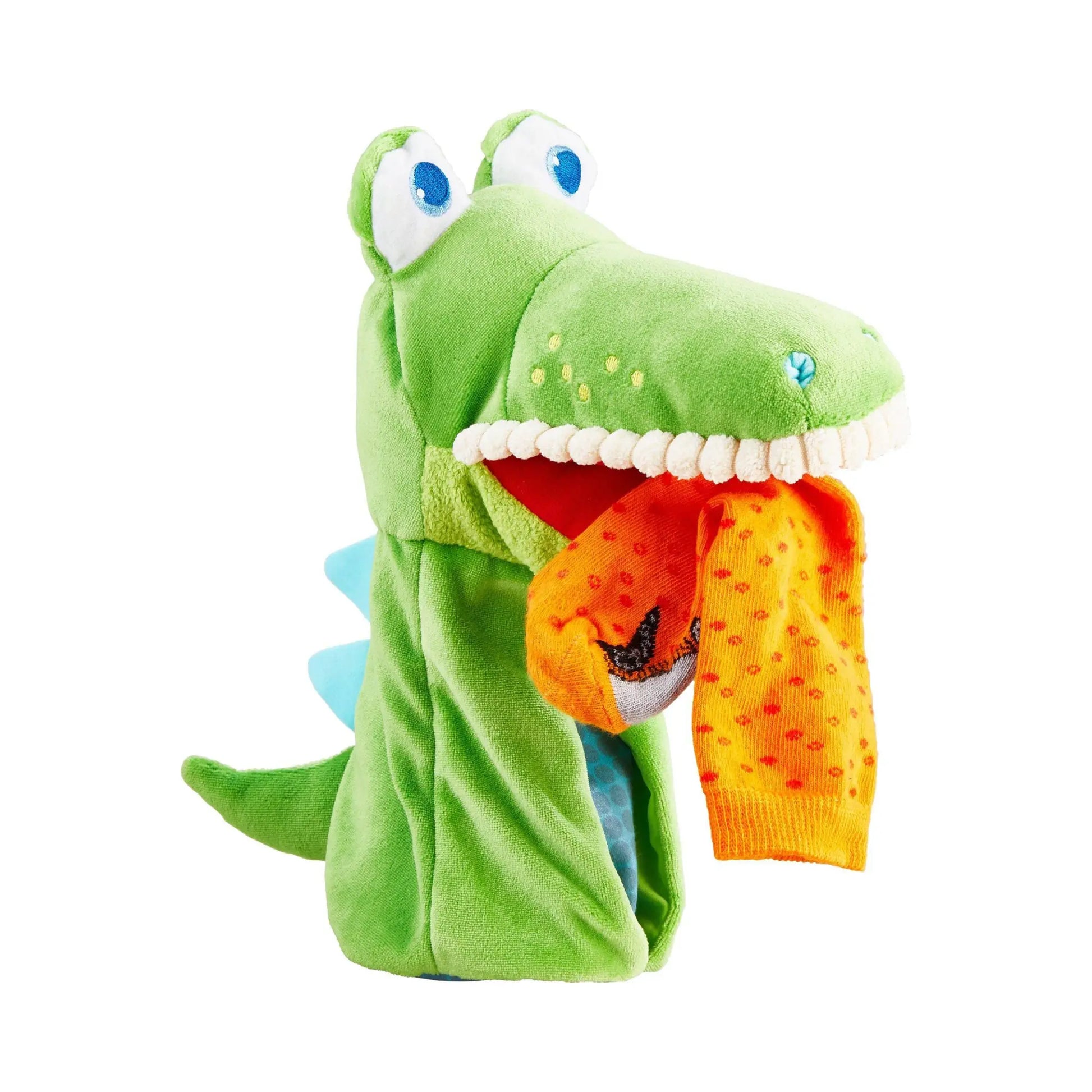 Green kids hand puppet of a crocodile with a sock in its mouth on a white background