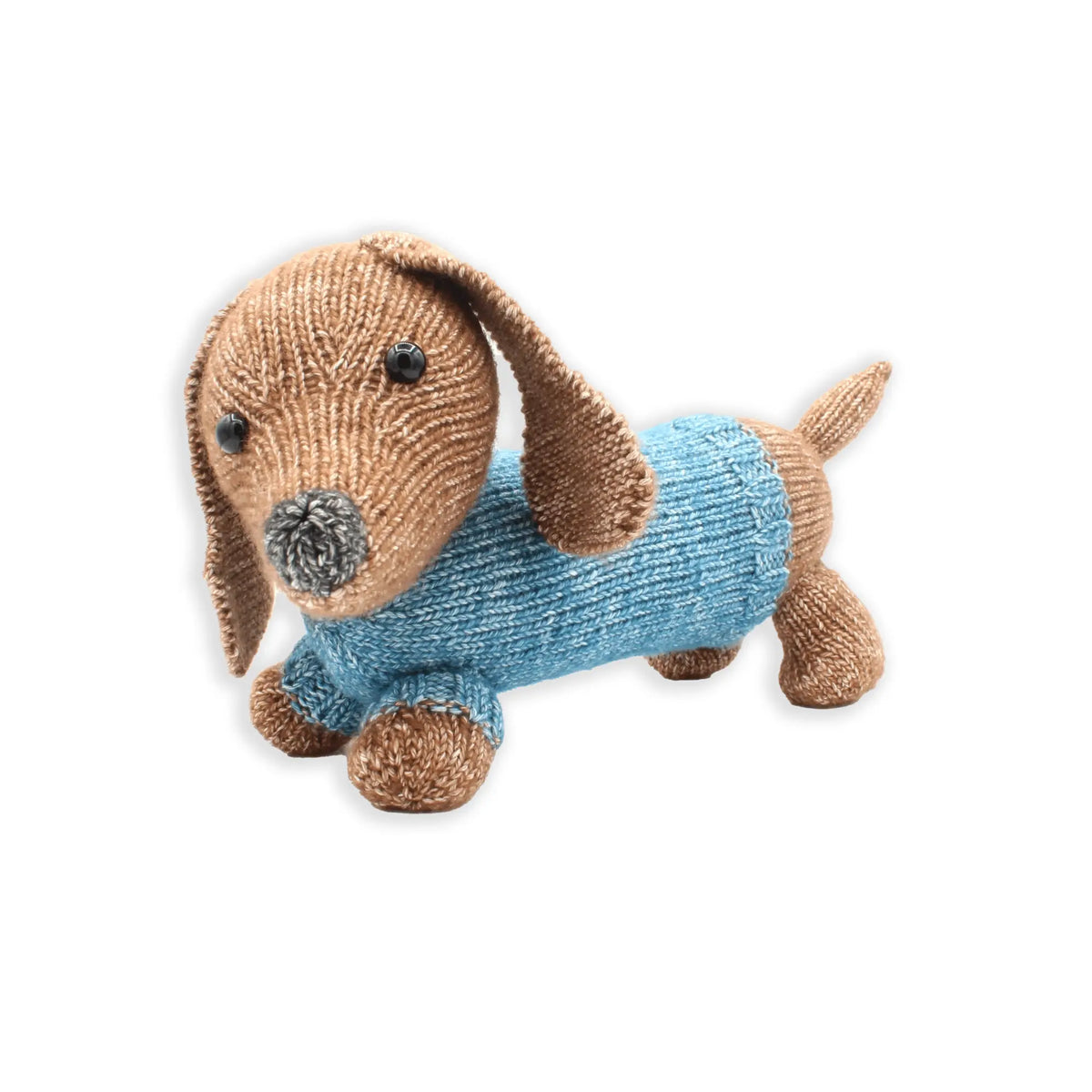 Finished knitted dachshund toy on white background