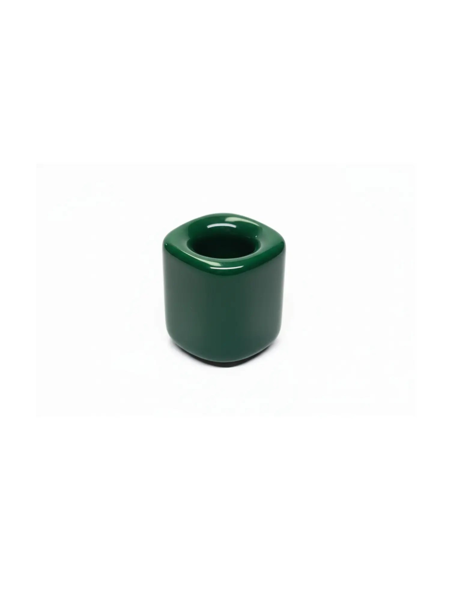 Dark green ceramic taper candle holder on a white background