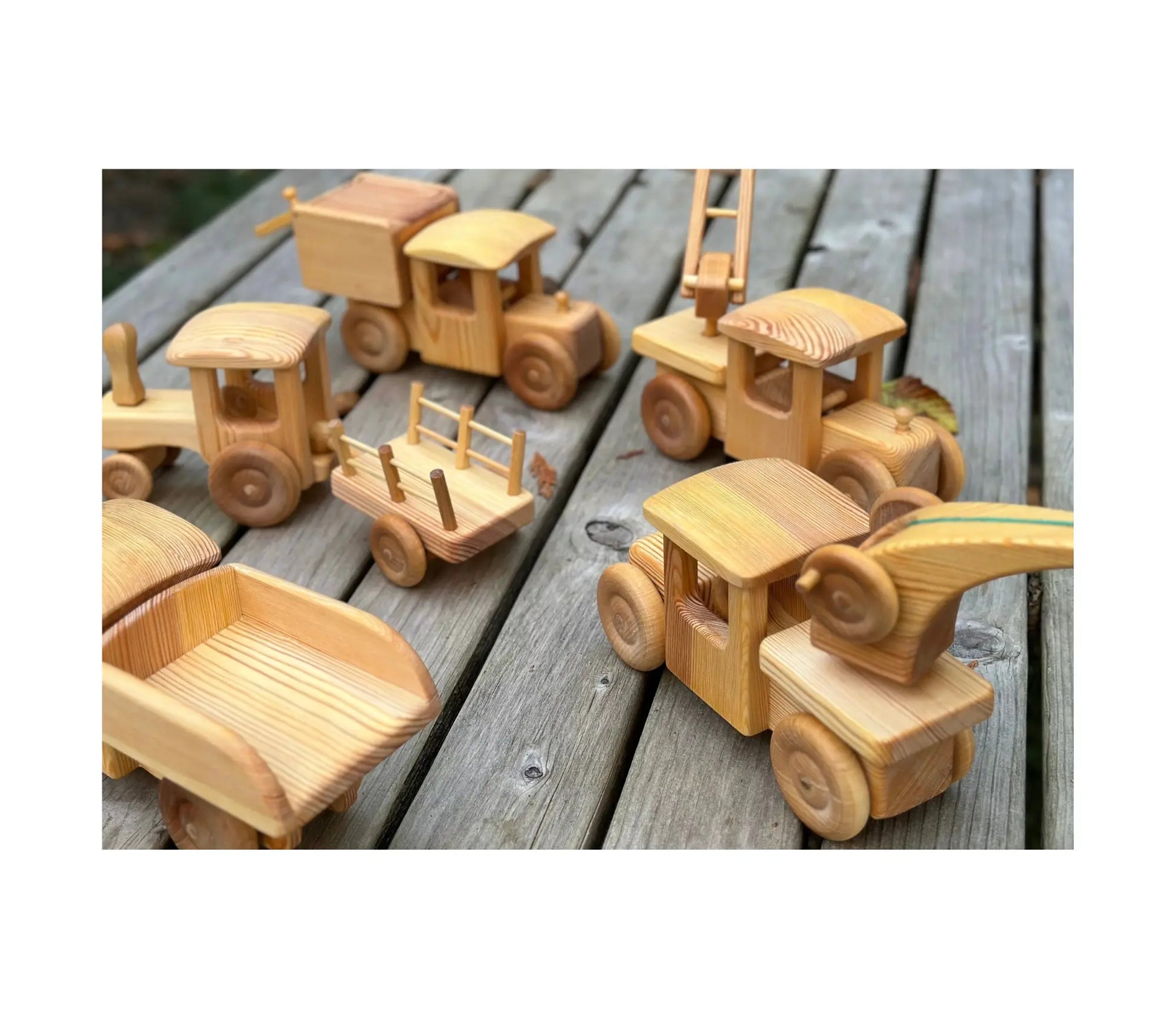Set of wooden toy vehicles on a wooden surface